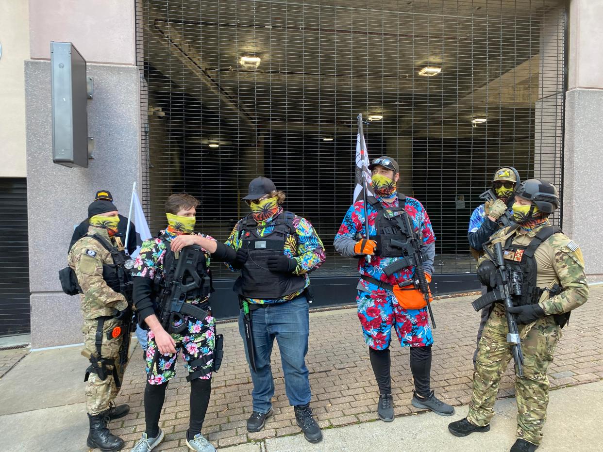 <p>A group of Boogaloo Boys gathers outside the state capitol building in Richmond, Virginia, for a gun rights rally. </p> (Richard Hall / The Independent )