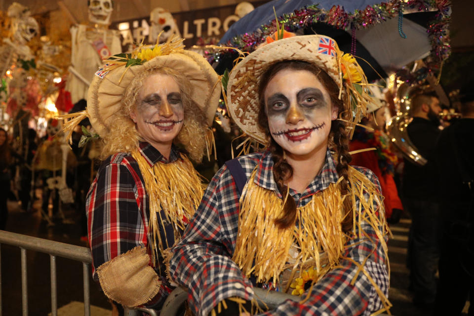 Two revelers dressed as scarecrows attend the Halloween Parade in New York. (Photo: Gordon Donovan/Yahoo News)