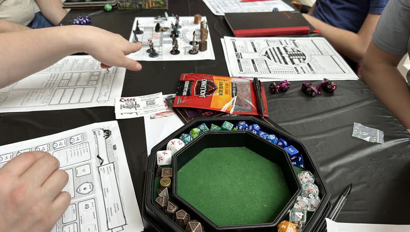 Participants play Dungeons and Dragons during an official attempt to break a Guinness World Record on Saturday at Provo Towne Centre.