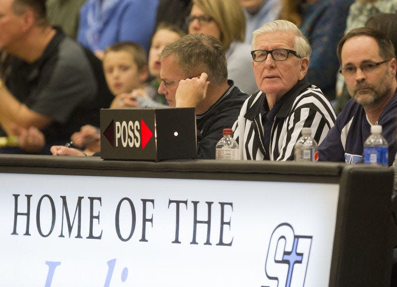 Al Maenhout works the scorer's table Jan. 22, 2016, during the Penn-St. Joseph boys basketball game at the Indians' gym in South Bend. Tribune Photo/GREG SWIERCZ