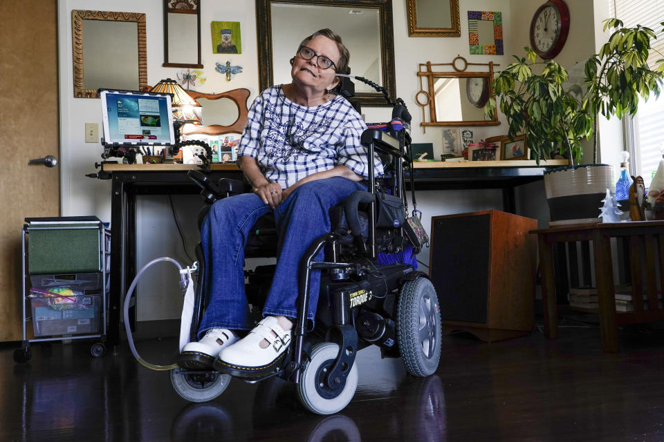 Martha Chambers pose in her apartment Friday, Sept. 2, 2022, in Milwaukee. Wisconsin voters with disabilities are celebrating a win after a federal judge, citing the Voting Rights Act, ruled that they may get assistance returning their ballots. (AP Photo/Morry Gash)