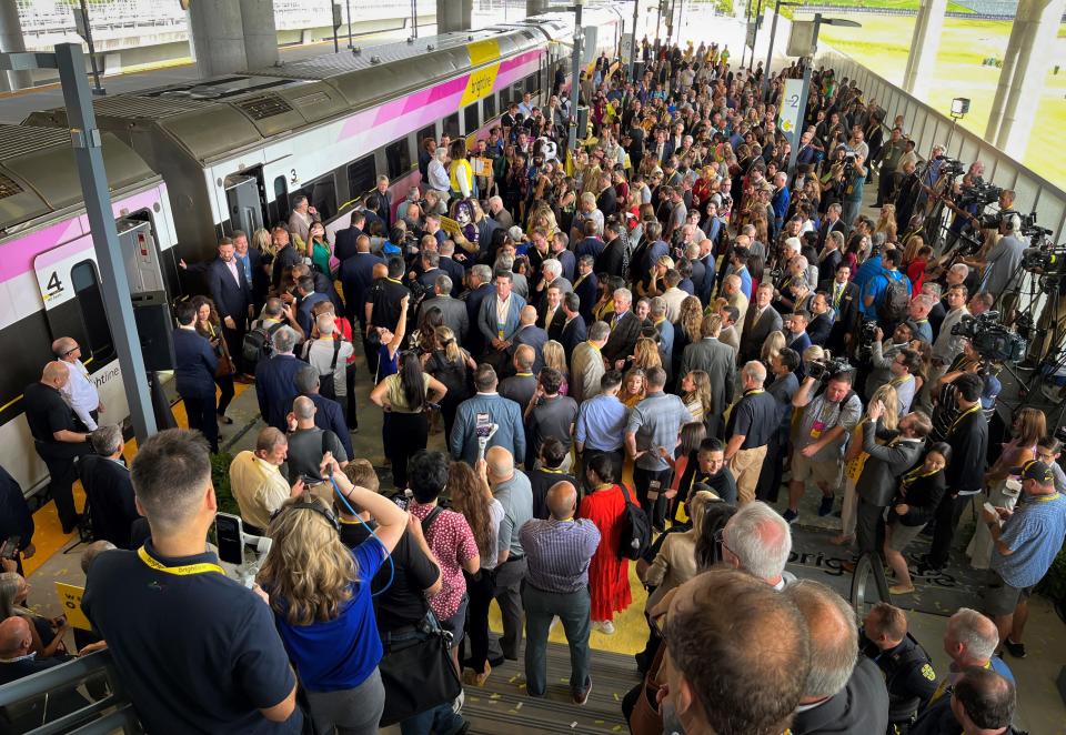 Crowds gather at the Orlando International Airport terminal to greet the high-speed Brightline train arriving on its inaugural trip from South Florida on September 22, 2023.