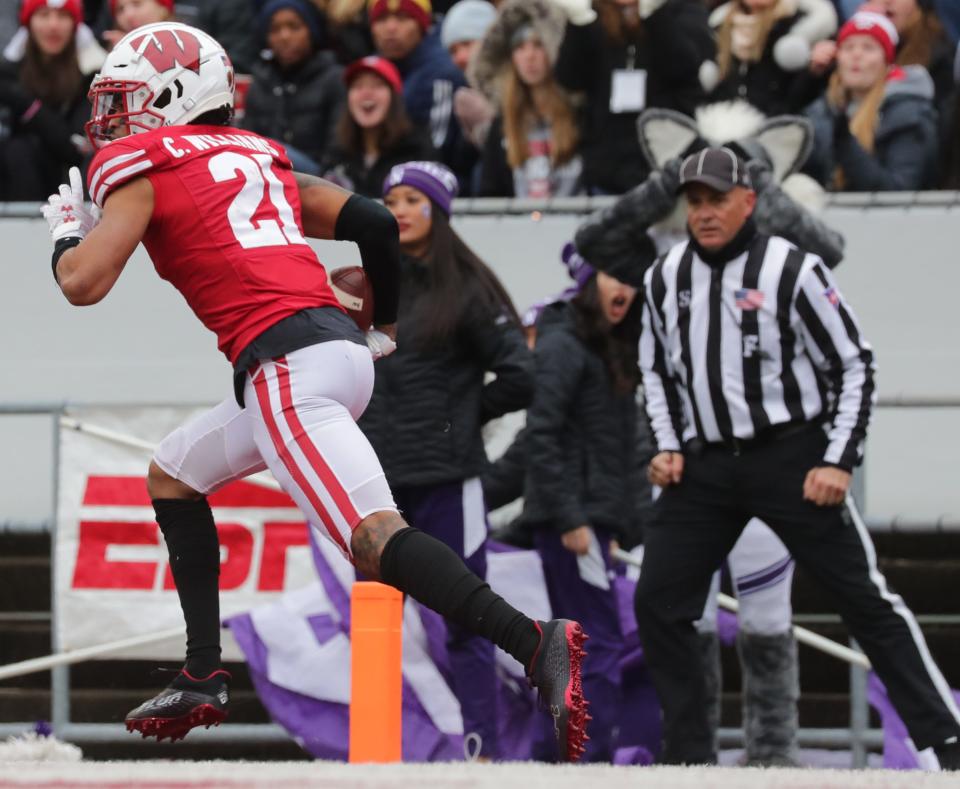 Wisconsin cornerback Caesar Williams returns an interception in the end zone during the first quarter Saturday against Northwestern.