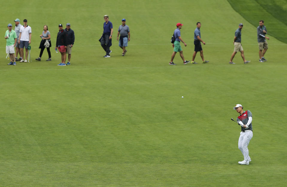 Jazz Janewattananond, of Thailand, hits off the 18th fairway during the second round of the PGA Championship golf tournament, Friday, May 17, 2019, at Bethpage Black in Farmingdale, N.Y. (AP Photo/Andres Kudacki)