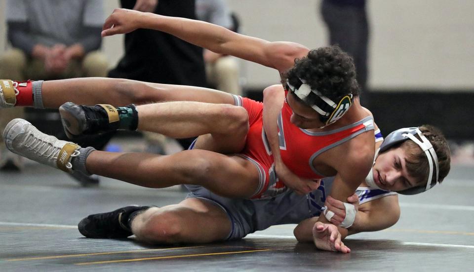Anthony Perez, bottom, takes down Edgewood's Quinten Gaines during a match last season. Perez will represent Streetsboro at the state tournament.
