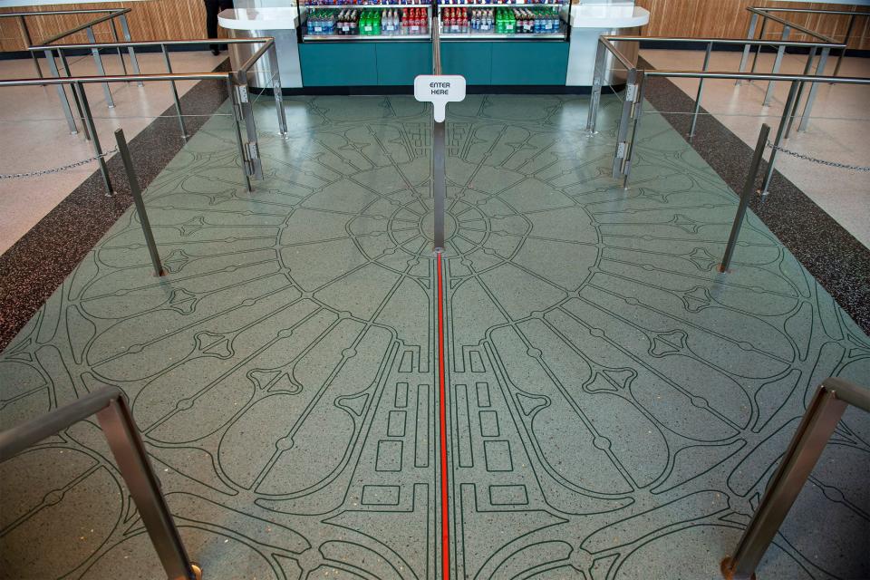 Floor inlays at Connections Café & Eatery are inspired by Walt Disney’s original design plans for EPCOT.