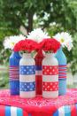 <p>Put old bottles and jars to use by creating a stunning floral centerpiece.</p><p><em><strong>Get the tutorial from <a href="http://www.allthingsgd.com/2014/06/patriotic-painted-glass-bottles/" rel="nofollow noopener" target="_blank" data-ylk="slk:All Things G&D;elm:context_link;itc:0;sec:content-canvas" class="link ">All Things G&D</a>.</strong></em></p>