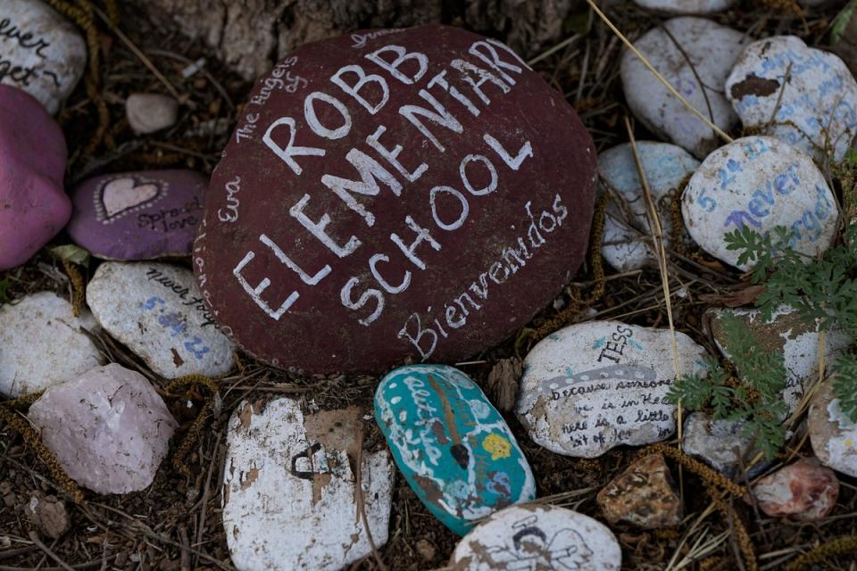 Decorated rocks honor the victims of the shooting at Robb Elementary School in Uvalde, Texas, on 3 May (Associated Press)