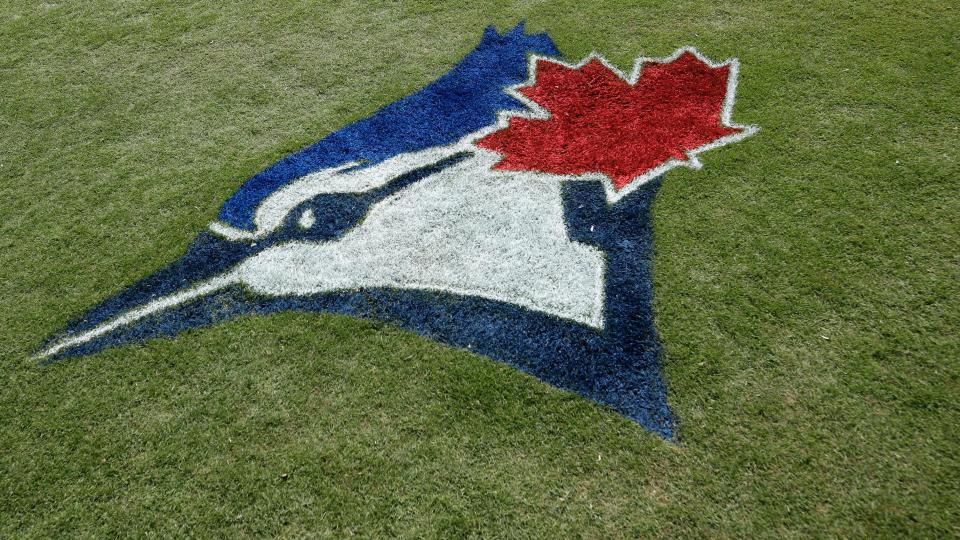 DUNEDIN, FL - FEBRUARY 24: General view of the Toronto Blue Jays logo painted in the grass prior to a Grapefruit League spring training game against the Atlanta Braves at TD Ballpark on February 24, 2020 in Dunedin, Florida. (Photo by Joe Robbins/Getty Images)