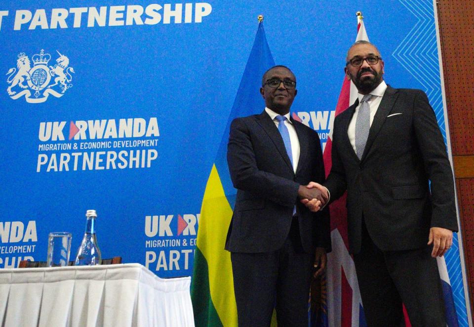 Home Secretary James Cleverly and Rwandan Minister of Foreign Affairs Vincent Biruta shake hands after they signed a new treaty in Kigali, Rwanda. (PA)