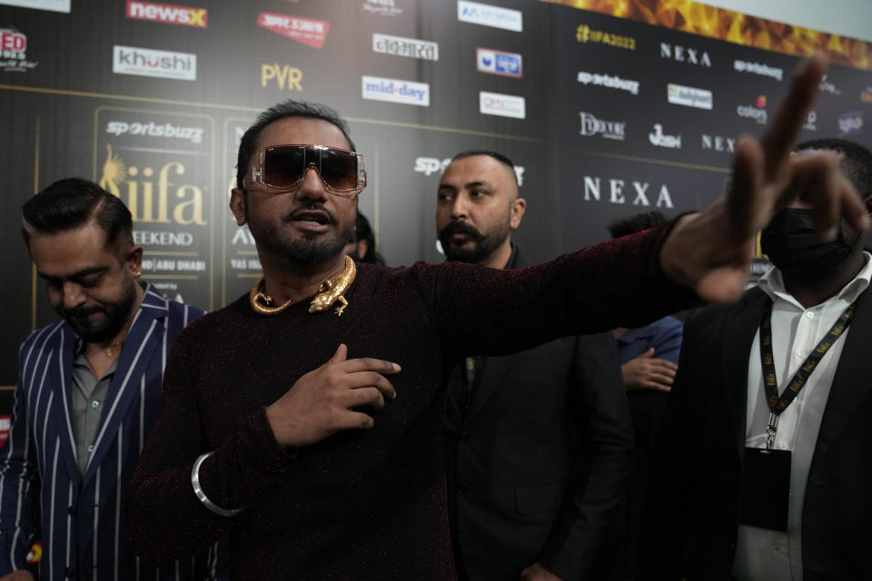 Indian musician Honey Singh gestures as he arrives on the green carpet ahead of the 22nd International Indian Film Academy (IIFA) awards in Abu Dhabi, United Arab Emirates, Friday, June 3, 2021. (AP Photo/Kamran Jebreili)