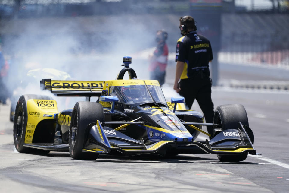 Colton Herta pulls out of the pits during practice for the IndyCar auto race at Indianapolis Motor Speedway, Friday, May 14, 2021, in Indianapolis. (AP Photo/Darron Cummings)