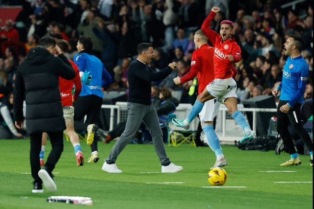 Girona’s head coach Michel, centre, celebrates their final goal in their stunning 4-2 victory over Barcelona 