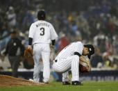 Japan's Kodai Senga reacts after giving up a double during the eighth inning of a semifinal in the World Baseball Classic against the United States, in Los Angeles, Tuesday, March 21, 2017. (AP Photo/Chris Carlson)