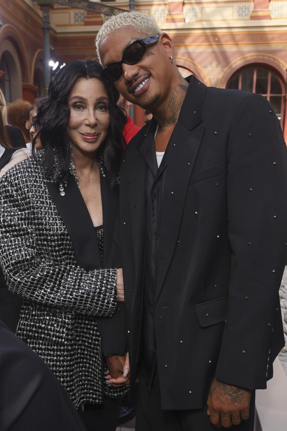 Cher, left, and Alexander Edwards attend the Valentino Spring/Summer 2024 womenswear fashion collection presented Sunday, Oct. 1, 2023 in Paris. (AP Photo/Vianney Le Caer)