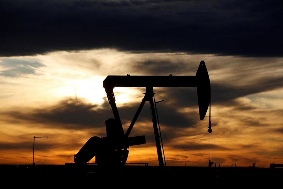 PHOTO: In this Nov. 24, 2019 file photo, the sun sets behind a crude oil pump jack on a drill pad in Loving County, Texas. (Angus Mordant/Reuters)