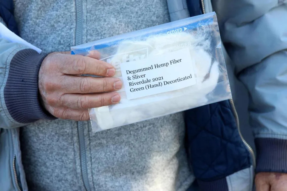 West Valley farmer Tom Pires shows a bag with industrial hemp product.