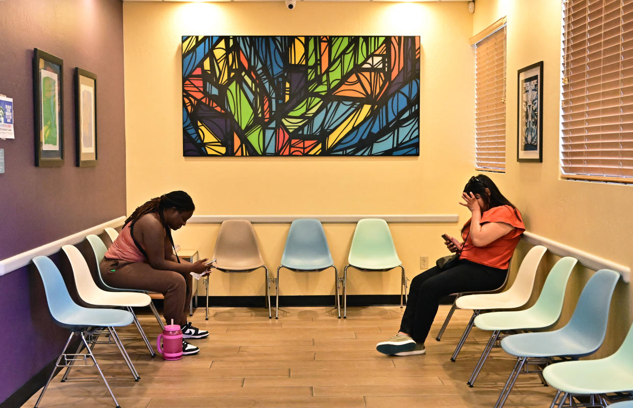 Two women sit in the waiting room of an abortion clinic in Phoenix.