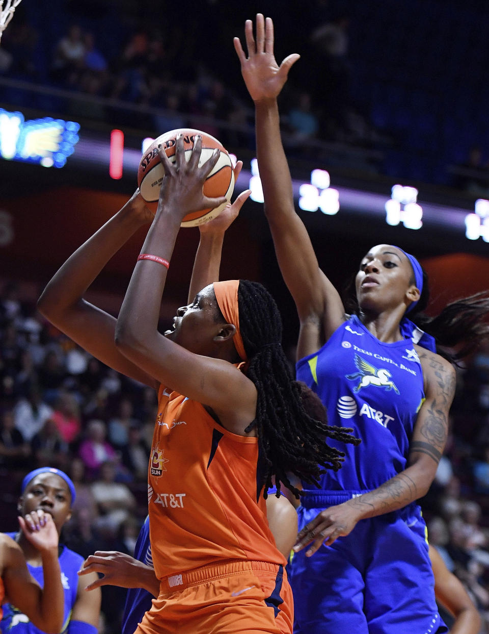 Connecticut Sun center Jonquel Jones drives by Dallas Wings forward Glory Johnson during a WNBA basketball game Wednesday, Sept. 4, 2019, in Uncasville, Conn. (Sean D. Elliot/The Day via AP)