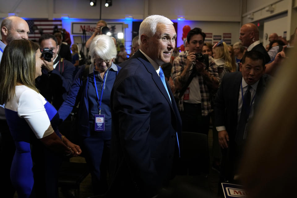 Republican presidential candidate former Vice President Mike Pence greets audience members at a campaign event, Wednesday, June 7, 2023, in Ankeny, Iowa. (AP Photo/Charlie Neibergall)