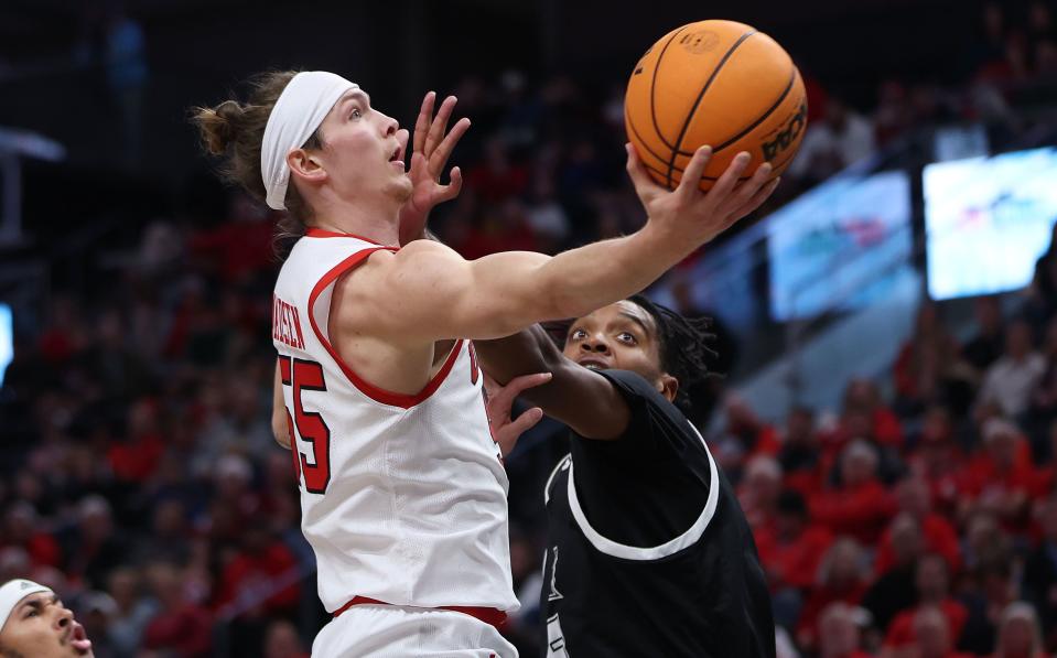 Utah Utes guard Gabe Madsen (55) drives on Hawaii Warriors forward Bernardo da Silva (5) at the Delta Center in Salt Lake City on Thursday, Nov. 30, 2023. | Jeffrey D. Allred, Deseret News