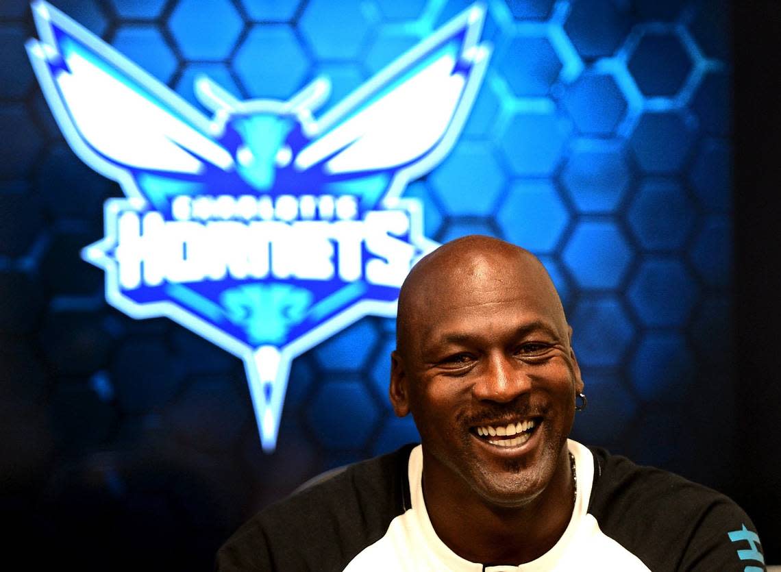 Charlotte Hornets owner Michael Jordan laughs while responding to a question on Tuesday, October 28, 2014 at Time Warner Cable Arena in Charlotte.