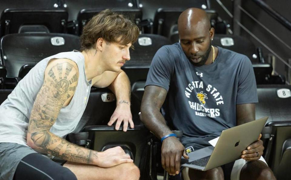 WSU assistant coach Quincy Acy, a former NBA big man, has become a mentor to the group of centers, including Jacob Germany (left), on the Shockers. Travis Heying/The Wichita Eagle
