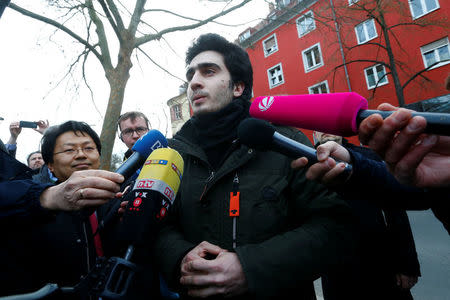 Syrian refugee Anas Modamani who takes Facebook to court over a selfie with Merkel speaks to journalits outside the district court in Wuerzburg, Germany February 6, 2017. REUTERS/Ralph Orlowski