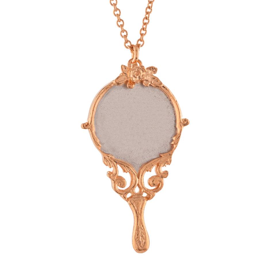 <p>Baroque Hand Mirror Necklace Engraved with "Tale as Old as Time", rose gold-plated with silver detail, £180</p>
