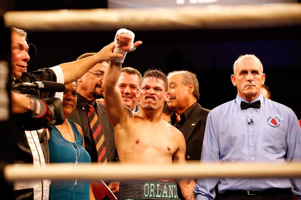 KISSIMMEE, FL - OCTOBER 19: Boxer Orlando Cruz celebrates victory over Jorge Pazos at Kissimmee Civic Center on October 19, 2012 in Kissimmee, Florida. (Photo by J. Meric/Getty Images)