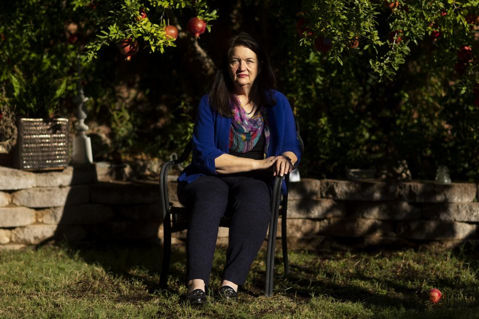 Mary Reed sits for a portrait in her backyard in Tucson on Oct. 29, 2020.