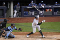 New York Yankees' Aaron Judge, right, strikes out on a pitch from Tampa Bay Rays relief pitcher Ryan Yarbrough during the fifth inning of a baseball game, Sunday, April 18, 2021, at Yankee Stadium in New York. Rays catcher Mike Zunino, second from left, and home plate umpire Erich Bacchus, left, are behind the plate. (AP Photo/Kathy Willens)