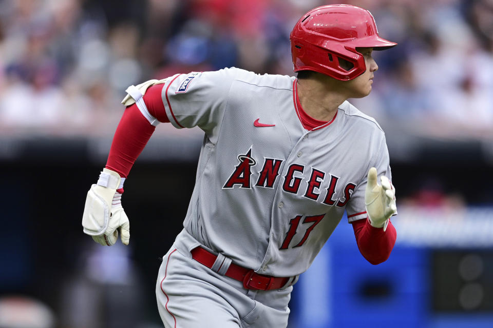 Los Angeles Angels' Shohei Ohtani runs after hitting an RBI double during the third inning of a baseball game against the Cleveland Guardians, Saturday, May 13, 2023, in Cleveland. (AP Photo/David Dermer)