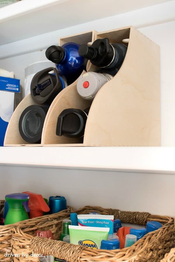 Use magazine holders for water bottles.