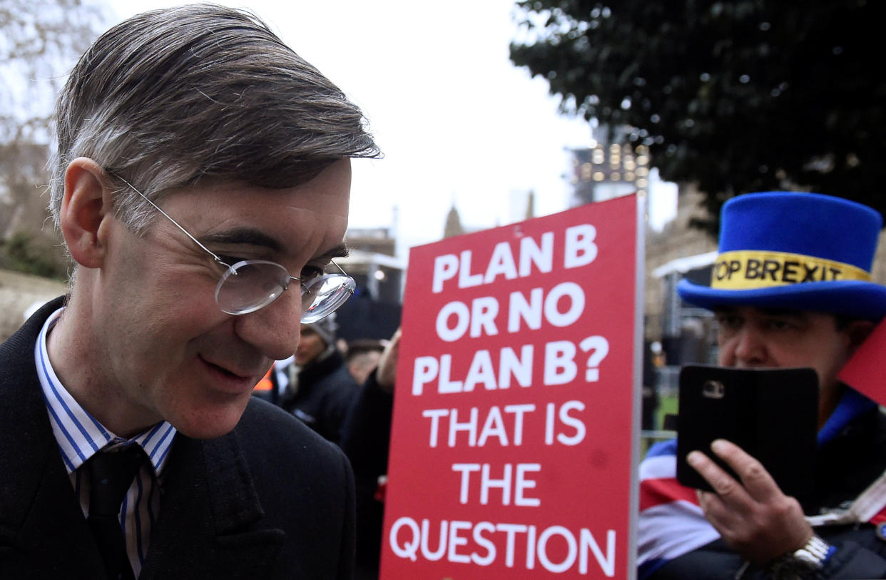 Jacob Rees-Mogg walks past an anti-Brexit protester (Reuters/Clodagh Kilcoyne)