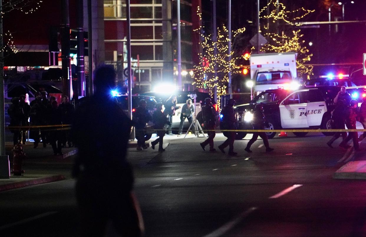 Investigators at a crime scene in Denver on Dec 27, 2021, after a shooting spree left five people dead and three others injured.