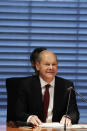 Olaf Scholz, Federal Minister of Finance and SPD top candidate for chancellor at the forthcoming General election, sits on the Finance Committee of the Bundestag in Berlin, Germany, Monday, Sept. 20, 2021. Scholz is to answer questions about the search of his ministry in connection with money laundering investigations. (Carsten Koall/dpa via AP)