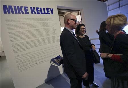 MOCA Curator Bennett Simpson (L) greets visitors during a media preview of an exhibition of work by the late artist Mike Kelley at The Geffen Contemporary at The Museum of Contemporary Art (MOCA) in Los Angeles, California March 28, 2014. REUTERS/Jonathan Alcorn