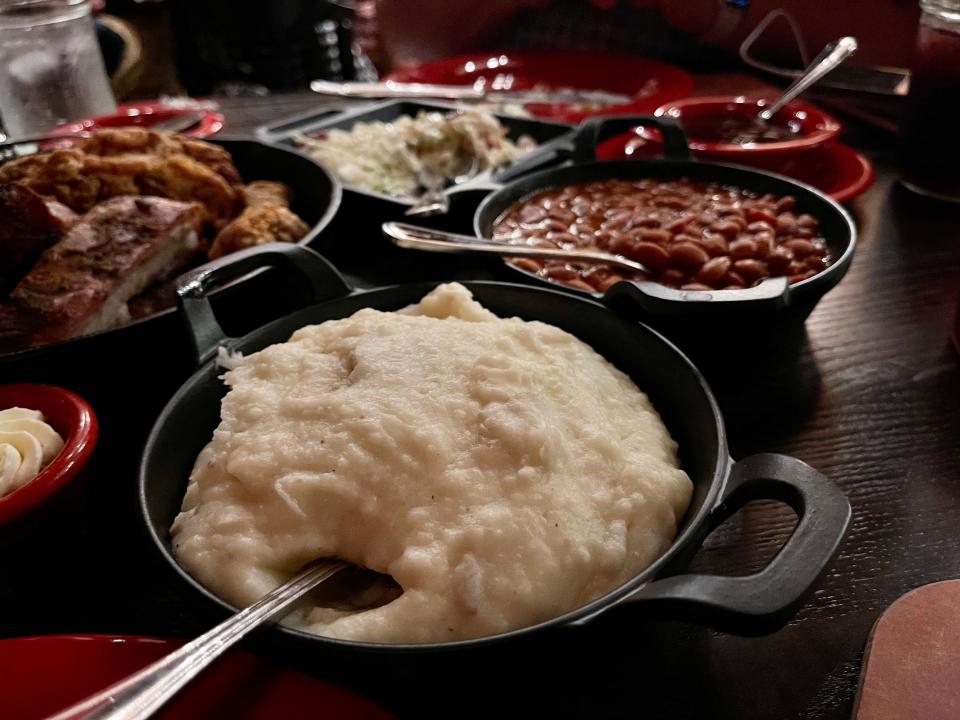 Hoop-De-Doo Revue at Disney - mashed potoatoes, beans, and more in skillets