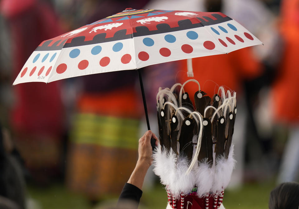 Indigenous people wait for Pope Francis during his visit to Maskwaci, the former Ermineskin Residential School, Monday, July 25, 2022, in Maskwacis, Alberta. Pope Francis traveled to Canada to apologize to Indigenous peoples for the abuses committed by Catholic missionaries in the country's notorious residential schools. (AP Photo/Eric Gay)