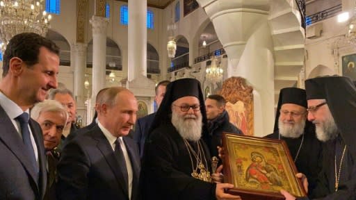 Russian President Vladimir Putin and Syrian President Bashar al-Assad visited the Mariamite�Cathedral in Damascus 3rd L) the Mariamite Cathedral of Damascus, one of the oldest Greek Orthodox churches in the Syrian capital, near Greek Orthodox Patriarch of Antioch and All East John X Yazigi (C).Putin met his Syrian counterpart Bashar al-Assad during an unprecedented visit to Damascus as the prospect of war between Iran and the United States loomed over the region