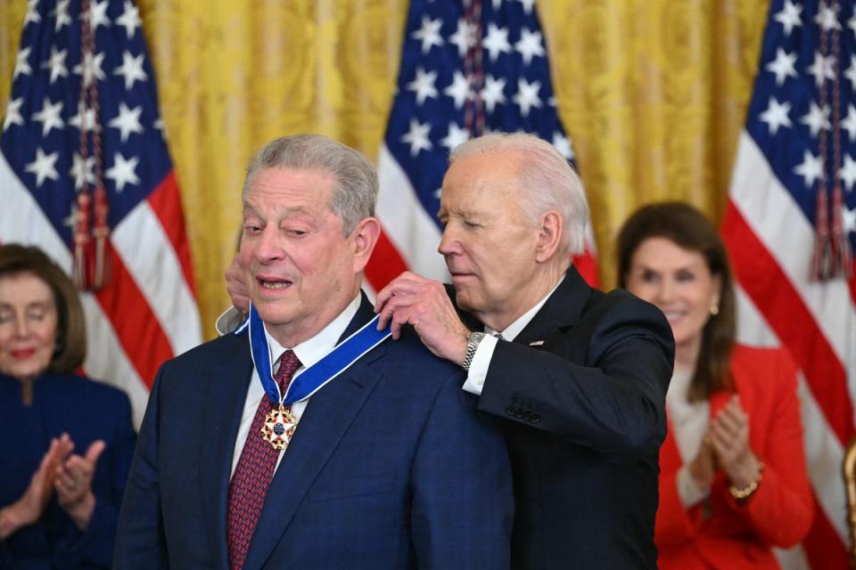 US President Joe Biden presents the Presidential Medal of Freedom to former US Vice President Al Gore in the East Room of the White House in Washington, DC, on 3 May 2024 (AFP via Getty Images)