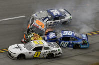 Noah Gragson (9), Caesar Bacarella (9), Jeffrey Earnhardt (0) and C.J. McLaughlin (74) tangle in a wreck during a NASCAR Xfinity Series auto race Saturday, Oct. 2, 2021, in Talladega, Ala. (AP Photo/Russell Norris)