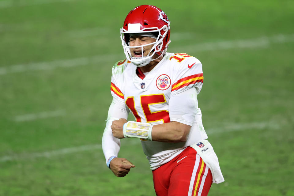 Quarterback Patrick Mahomes #15 reacts after a game winning touchdown pass to tight end Travis Kelce