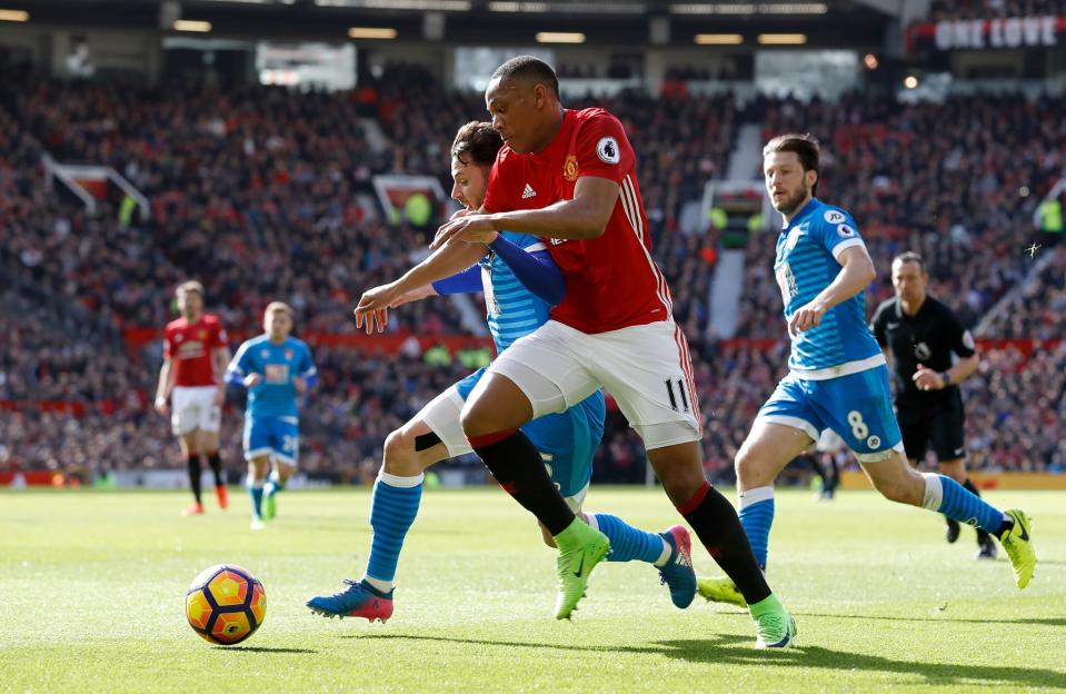 Anthony Martial muscles out Adam Smith