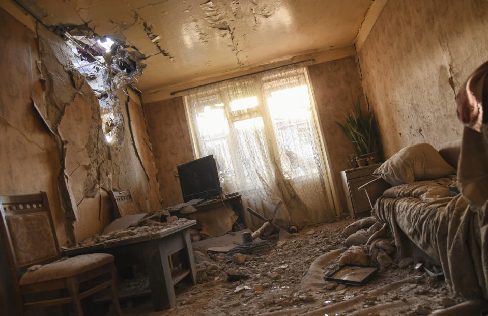 Damages are seen inside an apartment in a residential area after shelling during a military conflict in self-proclaimed Republic of Nagorno-Karabakh, Stepanakert, Azerbaijan, Saturday, Oct. 3, 2020. The fighting is the biggest escalation in years in the decades-long dispute over the region, which lies within Azerbaijan but is controlled by local ethnic Armenian forces backed by Armenia. (David Ghahramanyan/NKR InfoCenter PAN Photo via AP)