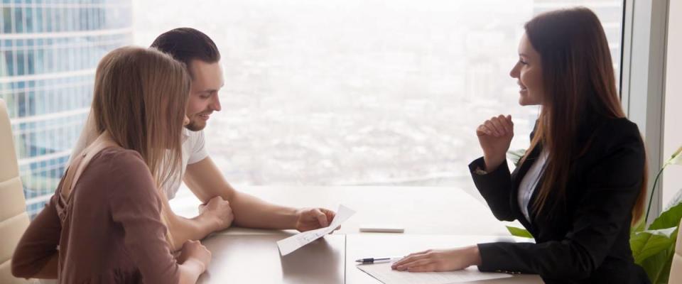 Young couple getting a personal loan.