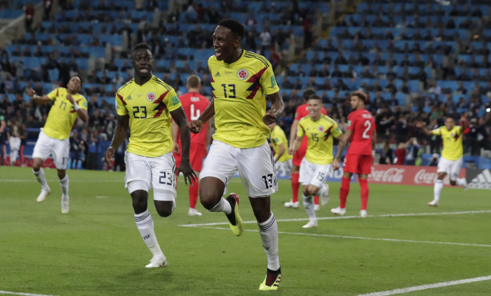 <p>Heartbreak for England: Colombia’s Yerry Mina celebrates after scoring an injury-time equaliser </p>