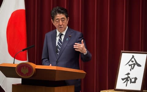 Japan's Prime Minister Shinzo Abe announces the new imperial era, which will begin next month - Credit: &nbsp;KAZUHIRO NOGI/AFP