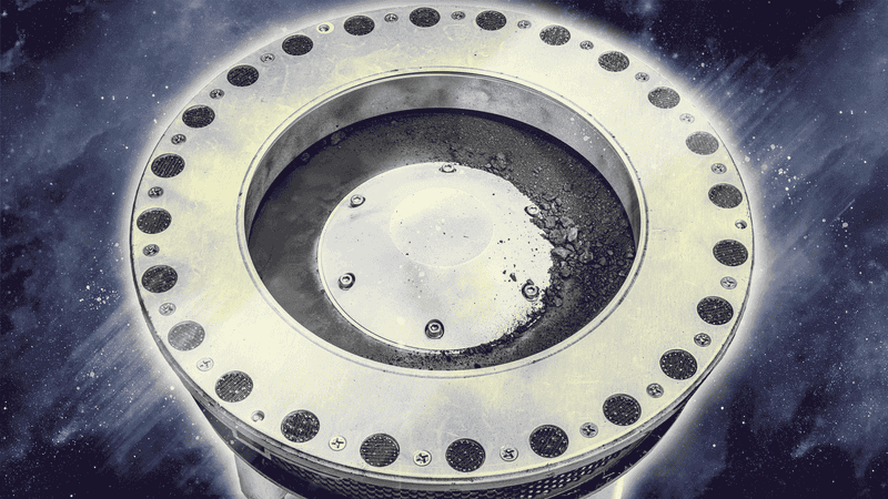 The OSIRIS-REx sample canister, covered with bits of an ancient asteroid.